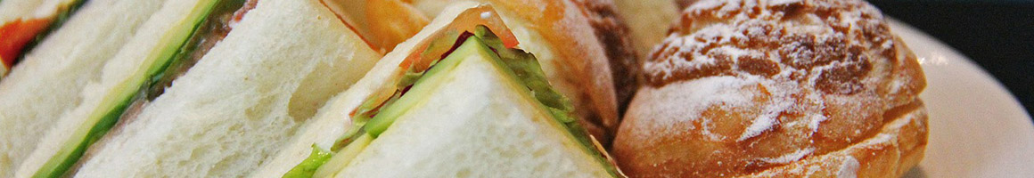 Eating Deli Sandwich at Frigo Foods restaurant in East Longmeadow, MA.
